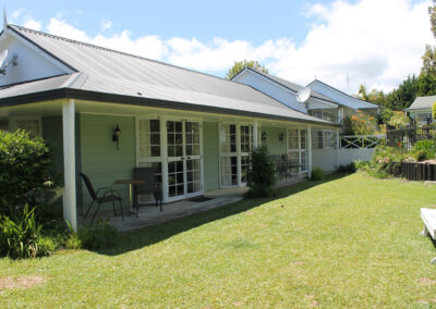 Exterior of the Deluxe King Studio units at Ash Grove Motel in Paihia, with private patios and garden views.