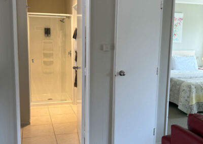Entrance to the bathroom and bedroom inside the One Bedroom Unit at Ash Grove Motel.
