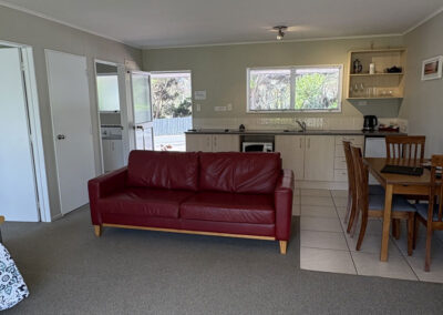 Spacious living area and kitchen inside the One Bedroom Unit at Ash Grove Motel.